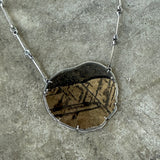 black and gold mica and enamel pendant
