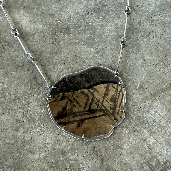 black and gold mica and enamel pendant