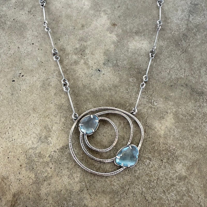 small constellation necklace with blue topaz
