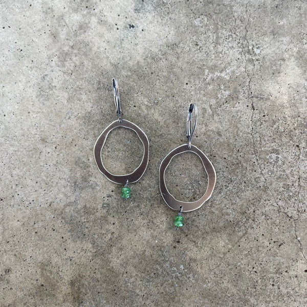 single rough cut earring with emerald