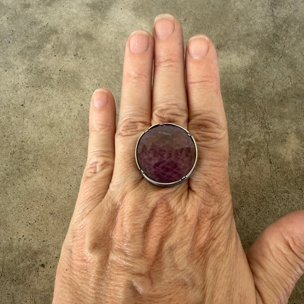 faceted round ruby ring