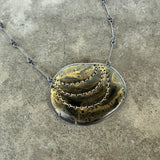 black and gold stitch enamel pendant