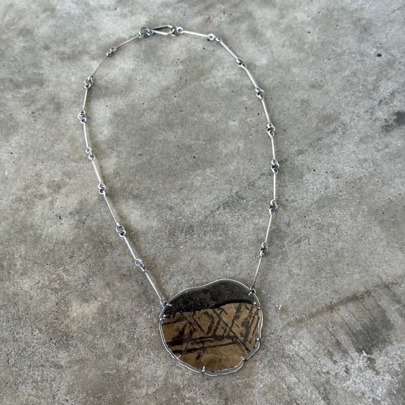 black and gold mica and enamel pendant