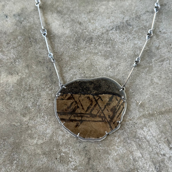 black and gold mica and enamel pendant