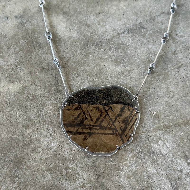 black and gold mica and enamel pendant