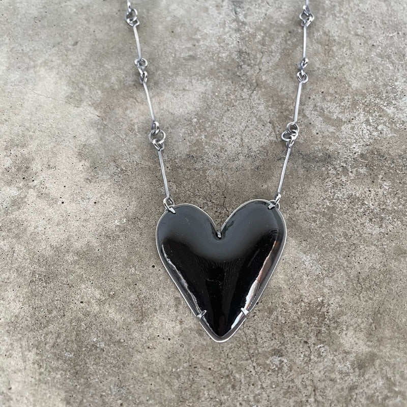 black enamel heart necklace set in oxidized sterling silver